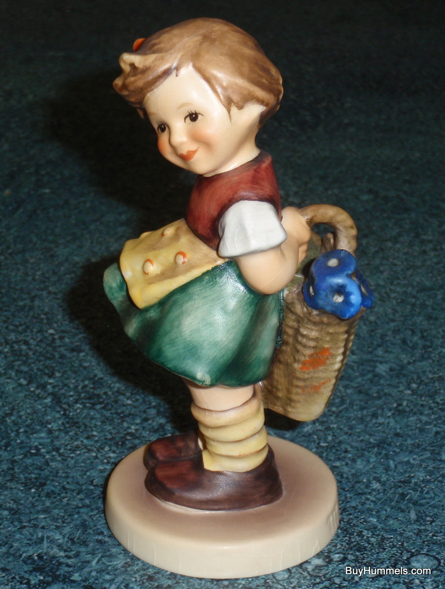 "Bashful" Goebel Hummel Figurine #377 - Girl With Basket Of Flowers
