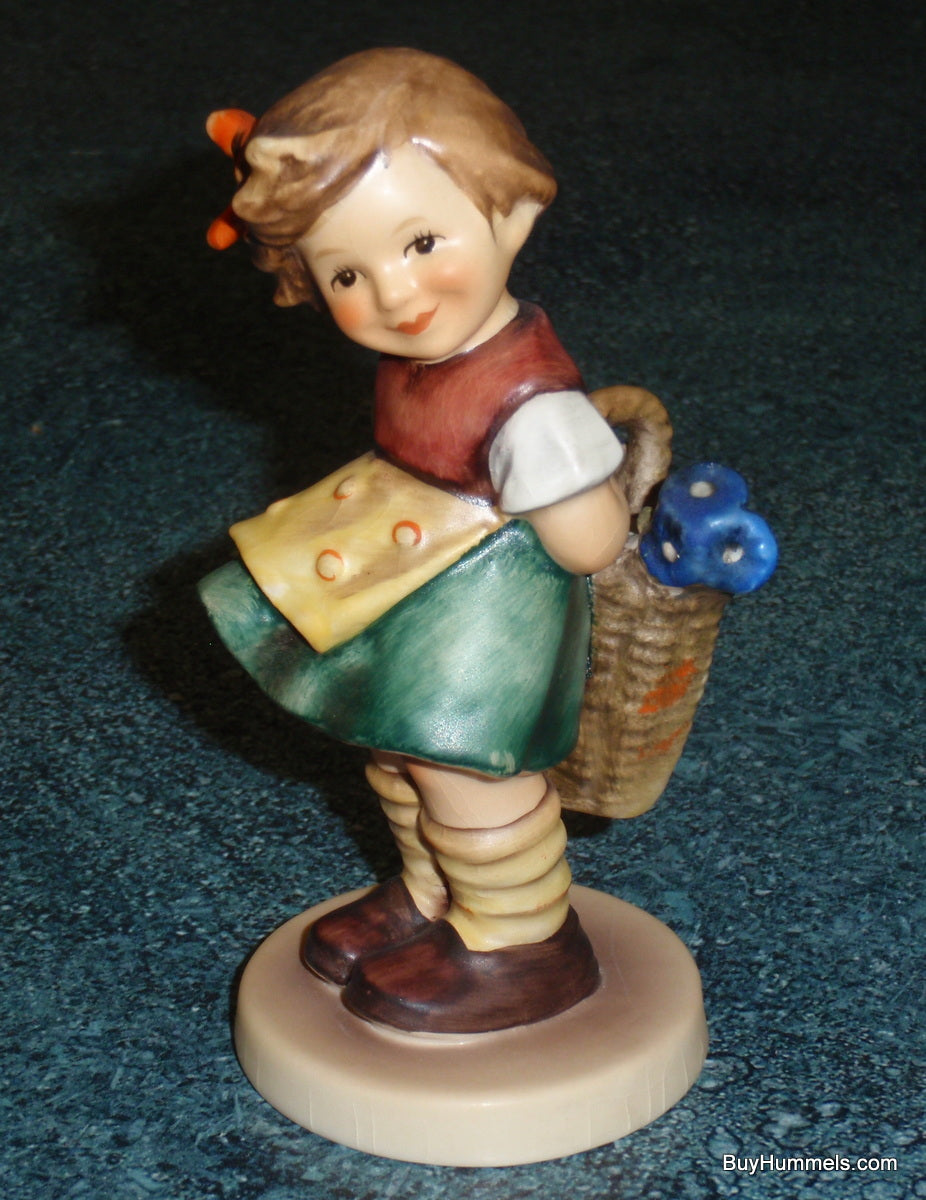 "Bashful" Goebel Hummel Figurine #377 - Girl With Basket Of Flowers