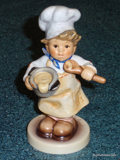 Goebel Hummel Figurine #2038 In The Kitchen - Young Boy Chef with Toque and Spoon - 4.6 Inches Tall - TMK8 Trademark - Helmut Fischer Master Sculptor - Mint Condition