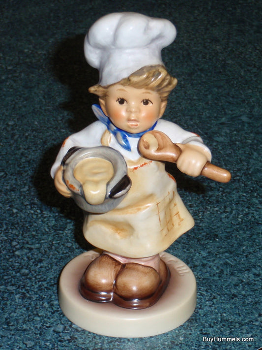 Goebel Hummel Figurine #2038 In The Kitchen - Young Boy Chef with Toque and Spoon - 4.6 Inches Tall - TMK8 Trademark - Helmut Fischer Master Sculptor - Mint Condition