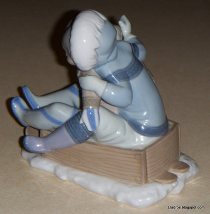 "Hang On" Lladro Figurine #5665 - Eskimo Children Sledding (5.75")