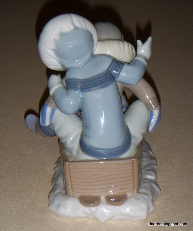"Hang On" Lladro Figurine #5665 - Eskimo Children Sledding (5.75")