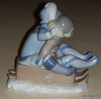 "Hang On" Lladro Figurine #5665 - Eskimo Children Sledding (5.75")