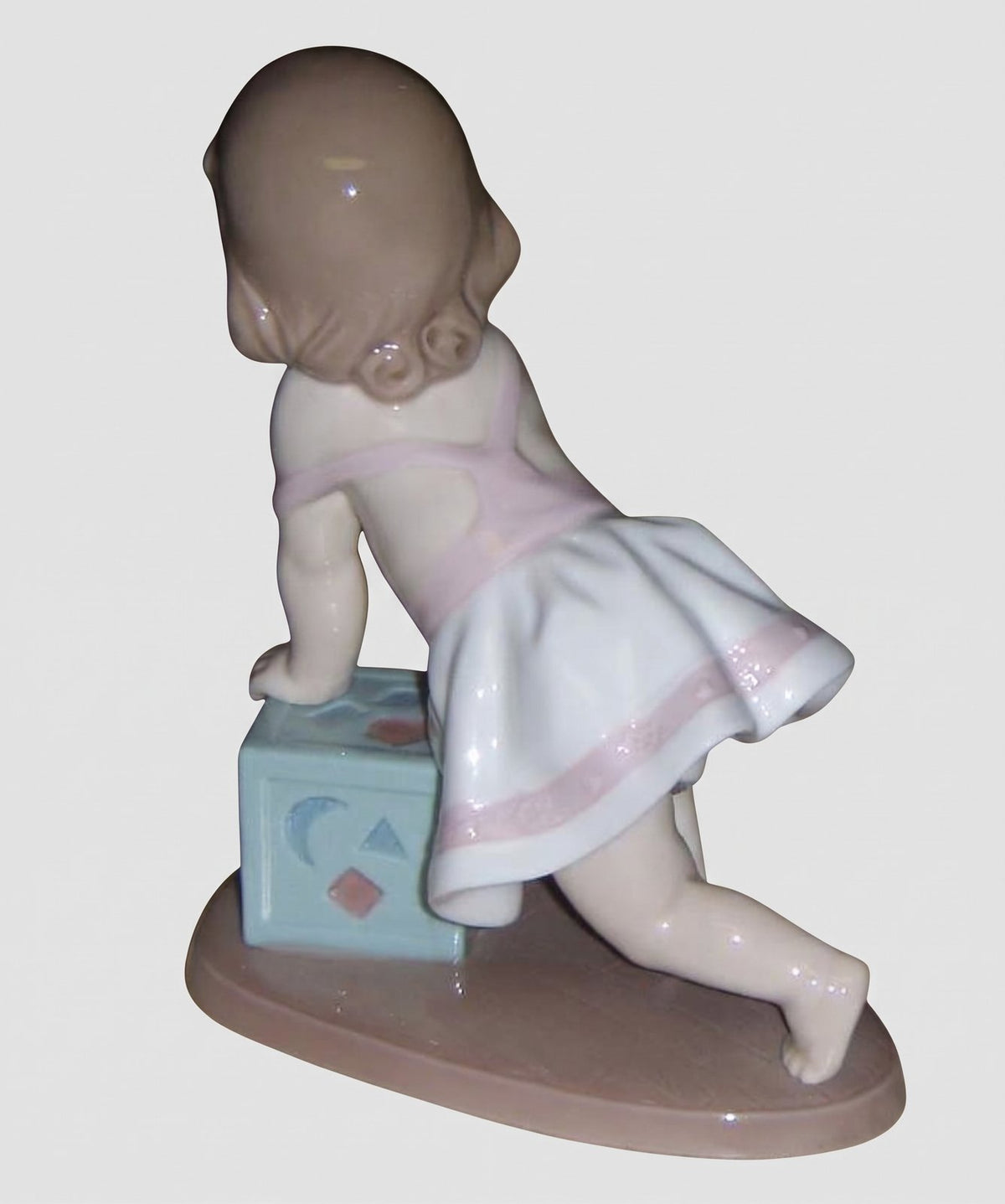 "My First Step" Lladro Figurine #6428 - Baby Girl with Block (6")