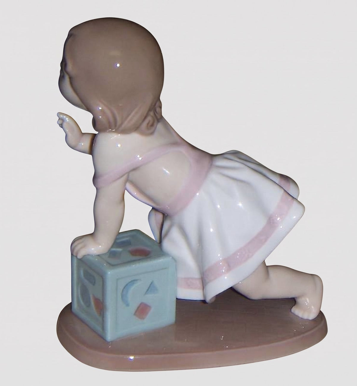 "My First Step" Lladro Figurine #6428 - Baby Girl with Block (6")