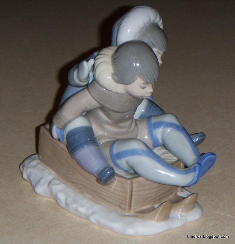 "Hang On" Lladro Figurine #5665 - Eskimo Children Sledding (5.75")