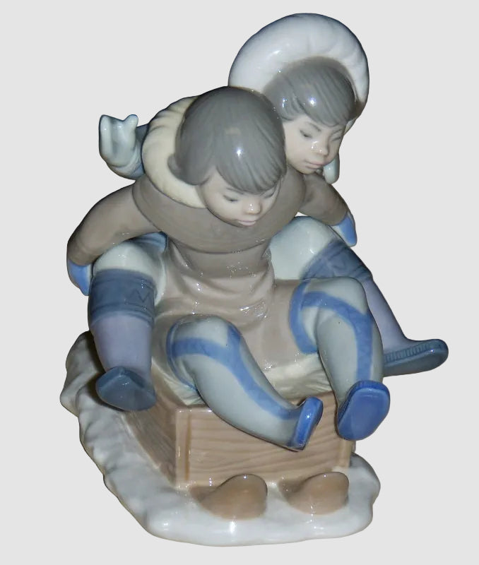 "Hang On" Lladro Figurine #5665 - Eskimo Children Sledding (5.75")