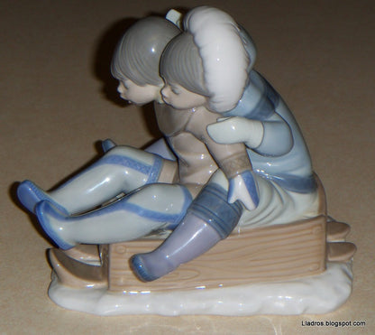 "Hang On" Lladro Figurine #5665 - Eskimo Children Sledding (5.75")