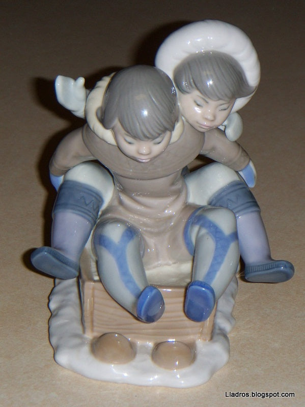 "Hang On" Lladro Figurine #5665 - Eskimo Children Sledding (5.75")