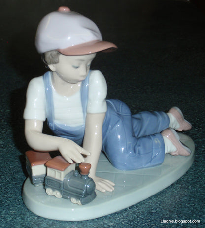 "All Aboard" Lladro Little Boy With Train Figurine #7619