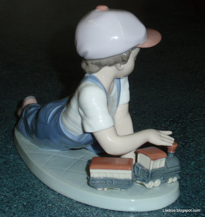 "All Aboard" Lladro Little Boy With Train Figurine #7619