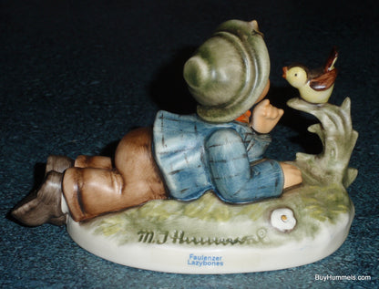 "Lazybones" Goebel Hummel Figurine #612/2/0 - Little Boy Laying In Meadow With Song Bird!