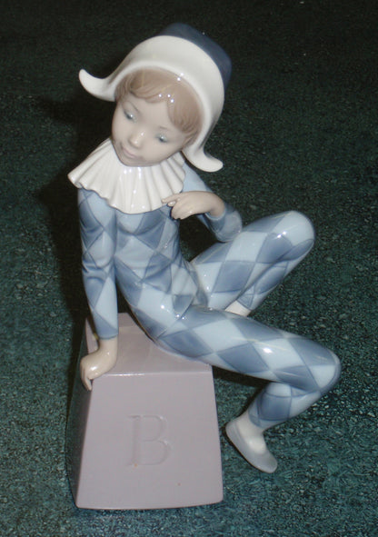 Lladro 5076 "Harlequin B" Figurine - Boy in Blue Clown Suit on Block (8")