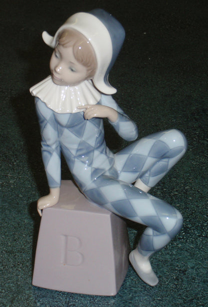 Lladro 5076 "Harlequin B" Figurine - Boy in Blue Clown Suit on Block (8")