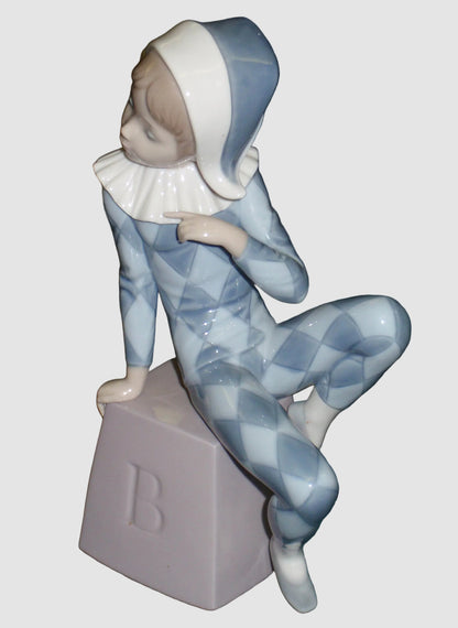 Lladro 5076 "Harlequin B" Figurine - Boy in Blue Clown Suit on Block (8")