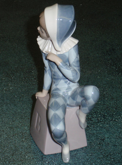 Lladro 5076 "Harlequin B" Figurine - Boy in Blue Clown Suit on Block (8")