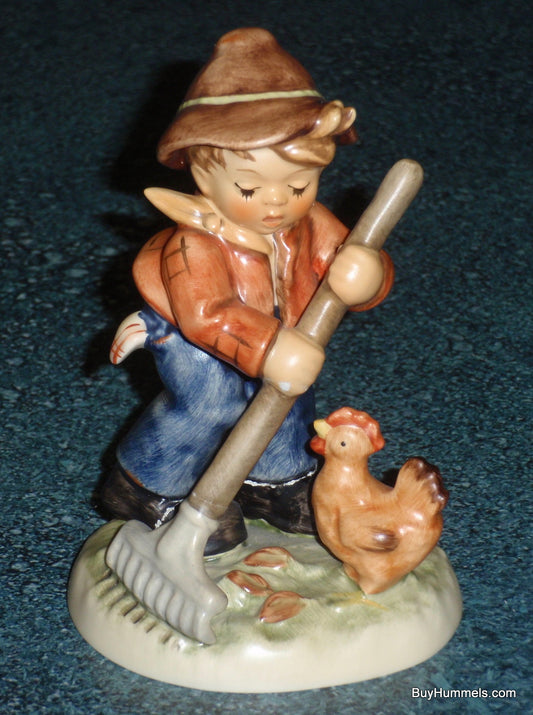Goebel Hummel 2085 Little Farm Hand Boy Raking with Chicken Figurine
