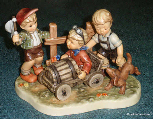 Goebel Hummel 2121 Soap Box Derby Three Boys Racing Car with Dog Figurine